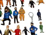 many different figurines of people in different poses