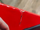 a person that is holding a red box with something in it