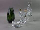 three glass vases sitting next to each other on a table