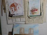 many pictures hanging on the wall of a room