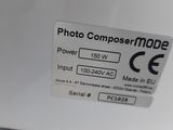 a close up of a photo composter mode sign on a refrigerator