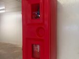 a red fire extinguisor on the wall of a building