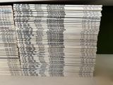 a lot of books stacked on top of each other