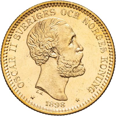 gros plan d'une pièce d'or sur laquelle figure le visage d'un homme