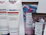 four different types of skin care products on a white surface