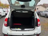 a white car with its trunk open in a parking lot