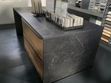 a marble counter top in the middle of a room