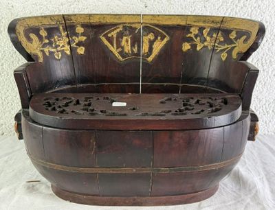 a wooden bench that has been carved into a barrel