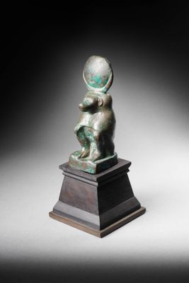 an image of a bronze statue of a child on a pedestal