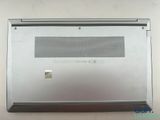 an open laptop computer sitting on top of a white table