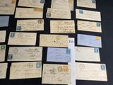 several old letters and envelopes on a table with a black background