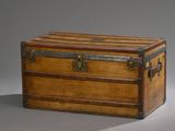 an old wooden trunk with metal handles and a latch on the top