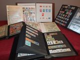 a lot of different stamps on a book on a table