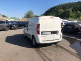 a white van that is parked in a parking lot