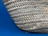 a basket that is sitting on a blue surface
