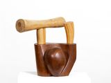 a wooden chair with a wooden handle on top of it