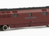 a toy train on a white surface with a white background