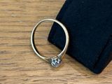 a ring that is sitting on top of a black bag