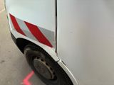 a white van with a red stripe on the side of it