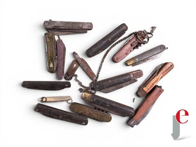 many different types of pocket knives on a white surface