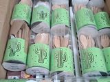 a cardboard box filled with wooden utensils and spoons