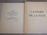 a book open on a table with writing on it