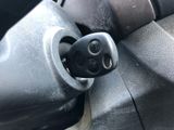 a close up of a car door handle with a button on it