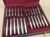a box with a set of silverware in it on a table