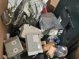 a cardboard box full of electronics and other items