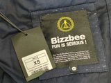 a label on the back of a jacket that says bizzlebee