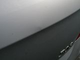 a close up of a car ' s door handle and the door handle of the car
