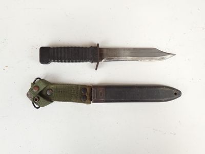 two knives that are sitting next to each other on a table