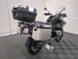 a motorcycle that is parked in a room with a checkered floor