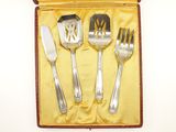 four forks and a knife in a case