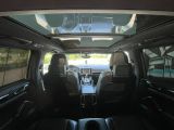 a view of the inside of a car from the passenger seat