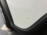a close up of a car ' s front bumper and fender