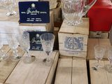 a lot of glassware on a table in a store