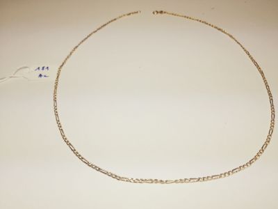 a close up of a necklace on a white surface