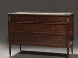 an antique chest of drawers with marble top in a room
