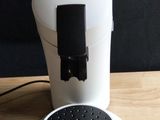 a coffee maker that is sitting on a wooden table
