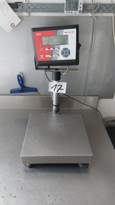 an image of a scale on a table in a kitchen