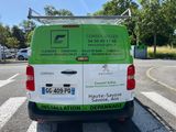 a van that is parked on the side of the road