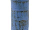 a blue vase that is sitting on a white surface