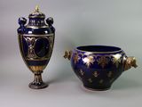 two vases sitting next to each other on a table
