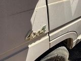 a white van that is parked on the side of the road