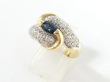 an image of a ring with a sapphire and diamonds