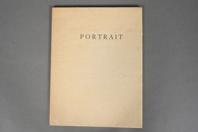a close up of a book on a gray surface
