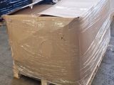 a pallet with a large box on it in a warehouse