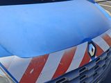 a blue van with a red and white stripe painted on it
