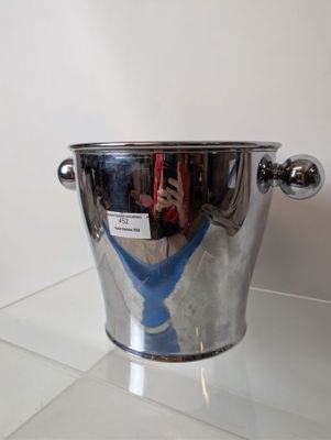a silver ice bucket with a blue tie on it